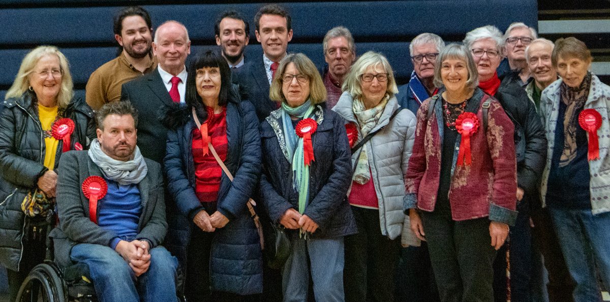 Labour Party campaigners standing for a formal photograph at the count for Brentwood Borough Council elections