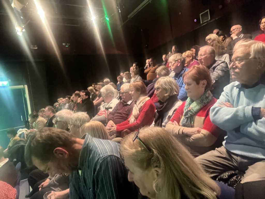 audience members seated